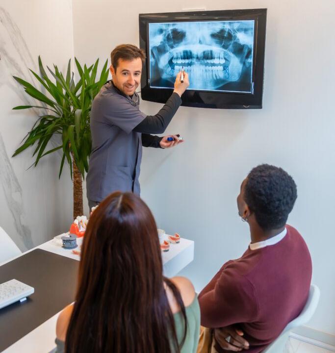 dentist showing teeth x ray to patients in modern 2025 04 09 15 11 14 utc